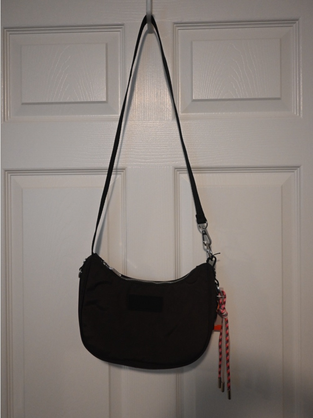 Hunter Black Crossbody Bag with Pink Accent Tassel